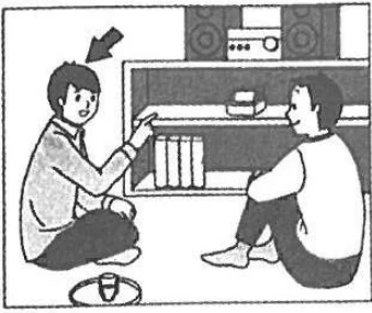 Scene: A woman standing by a desk where a man is working on a computer, arrow pointing to her — from the JLPT N3 Dec 2018 listening section